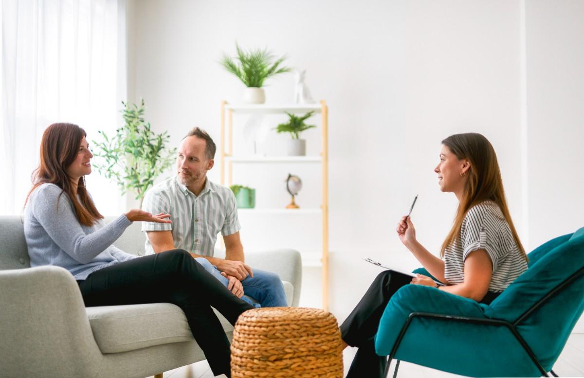 Couple attending a counselling session with a therapist.