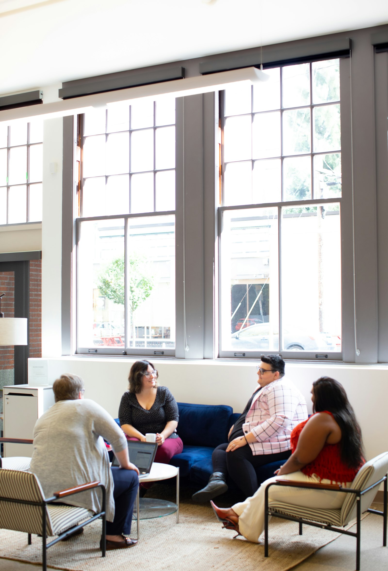 Therapist leading a group therapy session with participants.